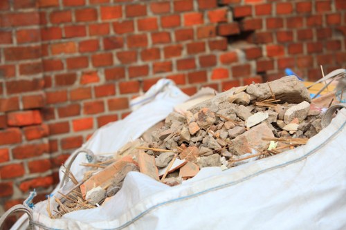 Professional team conducting loft clearance in a Belmont home